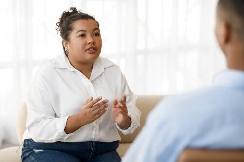 Pretty young mixed race woman plus size visiting psychologist